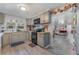 Modern kitchen with gray cabinets, butcher block countertops, and subway tile backsplash at 100 Cordova Rd, Auburndale, FL 33823