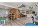 Spacious playroom with built-in shelving and wood flooring at 100 Cordova Rd, Auburndale, FL 33823