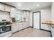 Modern kitchen with white cabinets and wood countertops at 223 E Ohio Ave, Lake Helen, FL 32744