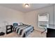 Bright bedroom with a double bed and window at 631 Samuel Pl, Davenport, FL 33837