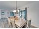 Dining room with light wood table and access to backyard at 631 Samuel Pl, Davenport, FL 33837