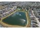 Neighborhood view of houses surrounding a scenic pond and recreation area at 108 Emeraldview Ave, Davenport, FL 33897