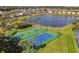 Community view with lake, tennis and basketball courts at 108 Emeraldview Ave, Davenport, FL 33897