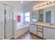 Bathroom featuring a bathtub and a shower with a sliding glass door at 108 Emeraldview Ave, Davenport, FL 33897