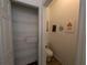 Small bathroom with toilet and linen closet at 108 Emeraldview Ave, Davenport, FL 33897