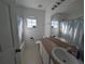 Clean bathroom with shower/tub combo, toilet and vanity at 108 Emeraldview Ave, Davenport, FL 33897