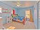 This is a bedroom with Super Mario decor and natural light at 108 Emeraldview Ave, Davenport, FL 33897