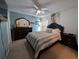 Main bedroom with a queen bed and dresser at 108 Emeraldview Ave, Davenport, FL 33897