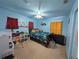 bedroom with a single bed and playful decor at 108 Emeraldview Ave, Davenport, FL 33897