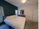 Bedroom with king-size bed and dresser at 108 Emeraldview Ave, Davenport, FL 33897