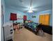 Themed bedroom with full-size bed and plenty of toys at 108 Emeraldview Ave, Davenport, FL 33897