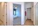 Bright bedroom with a ceiling fan, soft carpet, and a neutral color palette seen from the hallway at 108 Emeraldview Ave, Davenport, FL 33897