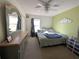 Main bedroom with a large bed and dresser at 108 Emeraldview Ave, Davenport, FL 33897