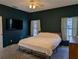 King-size bed in a bedroom with dark walls at 108 Emeraldview Ave, Davenport, FL 33897