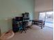 Game room with pool table, workspace, and access to the backyard at 108 Emeraldview Ave, Davenport, FL 33897