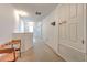 Carpeted upstairs hallway with neutral walls, leading to various rooms in the home at 108 Emeraldview Ave, Davenport, FL 33897