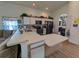 Modern kitchen with island, breakfast bar, and stainless steel appliances at 108 Emeraldview Ave, Davenport, FL 33897