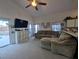 Relaxing living room with comfortable seating and access to the pool at 108 Emeraldview Ave, Davenport, FL 33897