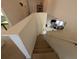 View down the stairs into the living area at 108 Emeraldview Ave, Davenport, FL 33897