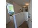 Upstairs hallway with view of bedroom and stairs at 108 Emeraldview Ave, Davenport, FL 33897