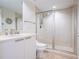 Modern bathroom with glass shower and white vanity at 241 Riverside Dr # 1203, Daytona Beach, FL 32117