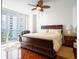 Comfortable bedroom with king-size bed and water views at 241 Riverside Dr # 1203, Daytona Beach, FL 32117