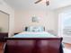 Comfortable bedroom with wood sleigh bed and water views at 241 Riverside Dr # 1203, Daytona Beach, FL 32117