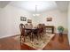 Elegant dining room with hardwood floors and a chandelier at 241 Riverside Dr # 1203, Daytona Beach, FL 32117