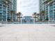 Inviting resort-style pool with surrounding lounge chairs at 241 Riverside Dr # 1203, Daytona Beach, FL 32117