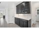 Kitchen with white cabinets, quartz countertops, and butler's pantry at 2557 Village Lakes Blvd, Lakeland, FL 33805