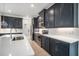 Modern kitchen with stainless steel appliances and white hexagonal backsplash at 2557 Village Lakes Blvd, Lakeland, FL 33805