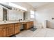 Double vanity bathroom with a relaxing jetted tub at 1046 Island Pointe Dr, Winter Garden, FL 34787