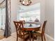 Kitchen breakfast nook with round table and window seat at 1046 Island Pointe Dr, Winter Garden, FL 34787