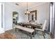 Dining room features a wooden table, bench seating, and large mirror at 1046 Island Pointe Dr, Winter Garden, FL 34787