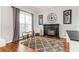 Living room features fireplace, hardwood floors, and built-in shelving at 1046 Island Pointe Dr, Winter Garden, FL 34787