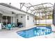 Inviting pool area with covered patio and grill at 1046 Island Pointe Dr, Winter Garden, FL 34787