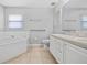 Bathroom with corner tub, double vanity and toilet at 2003 Rocky Pointe Dr, Lakeland, FL 33813