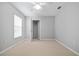 Bright bedroom featuring a ceiling fan and ample closet space at 2003 Rocky Pointe Dr, Lakeland, FL 33813