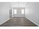 Bright dining room with chandelier and wood-look flooring at 2003 Rocky Pointe Dr, Lakeland, FL 33813