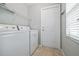 Laundry room with washer, dryer and exterior access at 2003 Rocky Pointe Dr, Lakeland, FL 33813