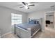 Bedroom with bed, window, and view of living room at 5157 Black Birch Trl, Mulberry, FL 33860