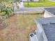 View of the home's backyard with a large grassy area at 803 E Valencia St, Lakeland, FL 33805