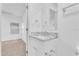 Modern bathroom with vanity and access to bedroom at 803 E Valencia St, Lakeland, FL 33805