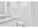 Clean bathroom with toilet and sink at 803 E Valencia St, Lakeland, FL 33805