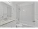 Clean bathroom, featuring a shower/tub combo and white vanity at 803 E Valencia St, Lakeland, FL 33805