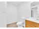Clean bathroom with toilet, sink, and vanity at 803 E Valencia St, Lakeland, FL 33805