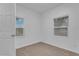 Simple bedroom with neutral walls and carpet at 803 E Valencia St, Lakeland, FL 33805