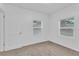 Bright bedroom with neutral walls, carpet, and two windows at 803 E Valencia St, Lakeland, FL 33805