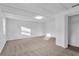 Large bedroom with neutral carpeting and a spacious closet at 803 E Valencia St, Lakeland, FL 33805