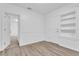 Bright bedroom with built-in shelving and door at 803 E Valencia St, Lakeland, FL 33805